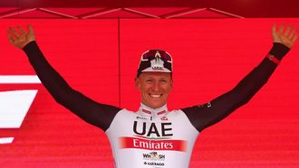 2023-05-17 18:15:27 UAE Team Emirates's German rider Pascal Ackermann celebrates on the podium after winning the eleventh stage of the Giro d'Italia 2023 cycling race, 219 km between Camaiore and Tortona, on May 17, 2023. 
Luca Bettini / AFP
