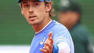 Australia's Alex De Minaur reacts as he plays against Switzerland's Stan Wawrinka during their Monte Carlo ATP Masters Series Tournament round of 64 tennis match on the Rainier III court at the Monte Carlo Country Club on April 9, 2024. 
Valery HACHE / AFP