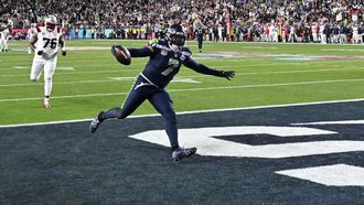 Seattle Seahawks’ linebacker #07 Uchenna Nwosu scores a touchdown during Super Bowl LX between the New England Patriots and the Seattle Seahawks at Levi's Stadium in Santa Clara, California on February 8, 2026. 
JOSH EDELSON / AFP
