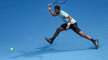 France's Gael Monfils hits a return against USA's Ben Shelton during their men's singles match on day nine of the Australian Open tennis tournament in Melbourne on January 20, 2025. 
Adrian DENNIS / AFP