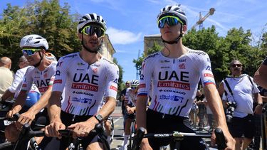 epa11451979 Slovenian rider Tadej Pogacar (R) of UAE Team Emirates speaks with his teammate British rider Adam Yates ahead of the start of the fourth stage of the 2024 Tour de France cycling race over 139km from Pinerolo to Valloire, 02 July 2024.  EPA/GUILLAUME HORCAJUELO