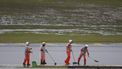 Marshals sweep the track after heavy rain fell at the Jose Carlos Pace racetrack, aka Interlagos, which forced the qualifying session for the upcoming Formula One Sao Paulo Grand Prix to be delayed, in Sao Paulo, Brazil, on November 2, 2024. 
Miguel Schincariol / AFP