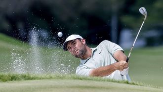 epa11578372 Scottie Scheffler of the US hits from a green side bunker on the first hole during the final round of the 2024 Tour Championship golf tournament at the East Lake Golf Club in Atlanta, Georgia, USA, 01 September 2024.  EPA/ERIK S. LESSER