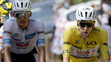 epa13107031 Yellow Jersey overall leader Slovenian cyclist Tadej Pogacar (R) and White Jersey best young rider Mexican cyclist Isaac del Toro (L) of UAE Team Emirates XRG in action during Stage 9 of the Tour de France, a 154.6 km route from Malemort to Ussel, France, 12 July 2026.  EPA/GUILLAUME HORCAJUELO