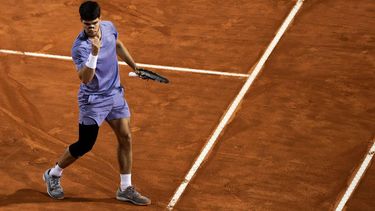Spain's Carlos Alcaraz reacts during his men's singles match against Serbia's Laslo Djere at the ATP Rome Open tennis tournament at Foro Italico in Rome on May 11, 2025.  
MARCO BERTORELLO / AFP
