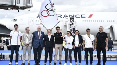 From left: Deputy for Sports Minister at the Paris town hall Pierre Rabadan, Vice-President of the Conseil departemental of Seine-Saint-Denis in charge of education Emmanuel Constant, Interministerial delegate for the Olympic and Paralympic Games (Dijop) Michel Cadot, President of French National Olympic Committee Brigitte Henriques, President of the Paris Organising Committee of the 2024 Olympic and Paralympic Games Tony Estanguet, Paris Mayor Anne Hidalgo, French Delegate Minister of Sports Roxana Maracineanu, Deputy Mayor in charge of the Olympic Games at the Seine-Saint-Denis department Mathieu Hanotin, Director General of the Paris 2024 Olympic Organizing Committee Etienne Thobois, pose for a photograph with the Olympic flag marking the handover from Japan to the next Games in Paris 2024, as French athletes returning from the Tokyo Olympic 2020 games disembark at Roissy-Charles de Gaulle airport, north of Paris on August 9, 2021.  France which won a total of 33 medals in the Tokyo Olympics will be host to the Paris 2024 Olympics. 

STEPHANE DE SAKUTIN / AFP