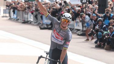 Alpecin-Deceuninck's Dutch rider Mathieu van der Poel celebrates after crossing the finish line to win the 122nd edition of the Paris-Roubaix one-day classic cycling race, 259,2 km between Compiegne and Roubaix, at the Vélodrome André-Pétrieux in Roubaix, northern France on April 13, 2025. 
Francois LO PRESTI / AFP