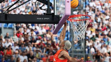 Netherlands' #54 Worthy de Jong scores in the men's pool round 3x3 basketball game between Poland and the Netherlands during the Paris 2024 Olympic Games at La Concorde in Paris on August 2, 2024. 
David GRAY / AFP