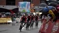 2023-08-26 20:47:56 Team Bahrain's cyclists ride under the rain during the first stage of the 2023 La Vuelta cycling tour of Spain, a 14,8 km team time-trial in Barcelona, on August 26, 2023. 
Pau BARRENA / AFP