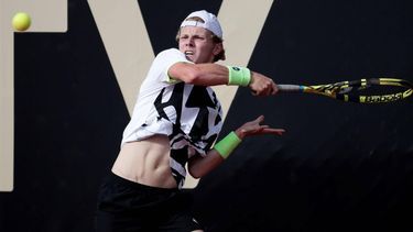 epa09542299 Dutch tennis player Jesper de Jong returns a ball to the Argentine Facundo Mena, during a match for the semifinals of the ATP Tennis Challenger tournament, at the Carmel Club in Bogota, Colombia, 23 October 2021.  EPA/Carlos Ortega