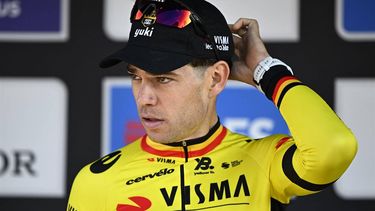 Team Visma-Lease a Bike's Belgian rider Wout van Aert reacts on the podium of the men's elite race 'Dwars Door Vlaanderen', 184,2 km from Roeselare to Waregem, on April 2, 2025. 
JASPER JACOBS / Belga / AFP
