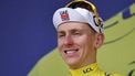 epa12249758 Yellow jersey overall leader Slovenian rider Tadej Pogacar of UAE Team Emirates waves on the podium after the 15th stage of the Tour de France cycling race over 169.3km from Muret to Carcassonne, France, 20 July 2025.  EPA/CHRISTOPHE PETIT TESSON