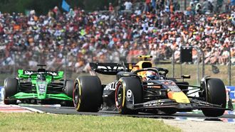 Team Red Bull's Sergio Perez and Team Sauber-Ferrari's Valtteri Bottas compete during the Formula One Hungarian Grand Prix at the Hungaroring race track in Mogyorod near Budapest on July 21, 2024. 
Attila KISBENEDEK / AFP