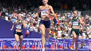 Netherlands' Femke Bol (C) crosses the finish line ahead of Britain's Jessie Knight (L) and South Africa's Zeney Geldenhuys (R) in the women's 400m hurdles heat of the athletics event at the Paris 2024 Olympic Games at Stade de France in Saint-Denis, north of Paris, on August 4, 2024. 
Jewel SAMAD / AFP