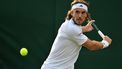 Greece's Stefanos Tsitsipas returns against Finland's Emil Ruusuvuori during their men's second round singles tennis match on the fourth day of the 2024 Wimbledon Championships at The All England Lawn Tennis and Croquet Club in Wimbledon, southwest London, on July 4, 2024. 
ANDREJ ISAKOVIC / AFP