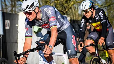 Alpecin-Deceuninck team Dutch Mathieu van der Poel (L) and Lotto Cycling Team Belgium's Arnaud De Lie compete during the Ename Samyn Classic, one day cycling race of 199,1 Km from Quaregnon to Dour, on March 4, 2025. 
Tom Goyvaerts / Belga / AFP