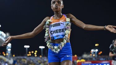 epa11332228 Beatrice Chebet of Kenya celebrates after winning the women's 5000 Metres final competition at the Doha Diamond League athletics meeting, in Doha, Qatar, 10 May 2024.  EPA/NOUSHAD THEKKAYIL