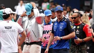 Cadillac's Mexican driver Sergio Perez (L), Mercedes' British driver George Russell (2nd L), Red Bull Racing's Dutch driver Max Verstappen (2nd R) and Ferrari's British driver Lewis Hamilton (R) arrive for the Driver's Parade ahead of the Formula One Bahrain Grand Prix in Sepang on October 4, 2026. 
I-HWA CHENG / AFP