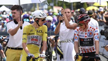 UAE Team Emirates - XRG's Slovenian rider Tadej Pogacar wearing the overall leader's yellow jersey and Team Visma | Lease a Bike's Danish rider Jonas Vingegaard wearing the climber's dotted 