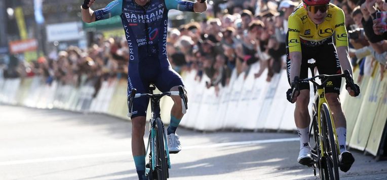 Bahrain - Victorious' French rider Lenny Martinez celebrates as he crosses crossing the finish ahead of Team Visma - Lease a Bike's Danish rider Jonas Vingegaard (R), to win the 8th and final stage of the Paris-Nice cycling race, 129.2 km between Nice and Nice, on March 15, 2026. 
Anne-Christine POUJOULAT / AFP