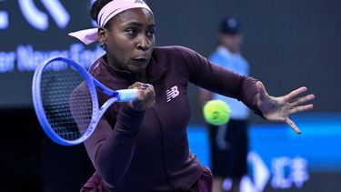 USA's Coco Gauff hits a return to China’s Sun Xinran during their women’s singles match at the China Open tennis tournament in Beijing on October 5, 2026. 
ADEK BERRY / AFP