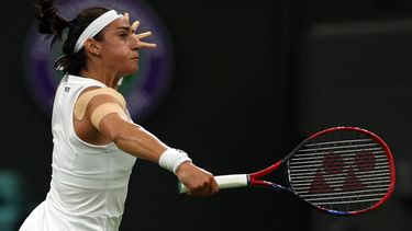 2023-07-07 22:51:47 France's Caroline Garcia returns the ball to Czech Republic's Marie Bouzkova during their women's singles tennis match on the fifth day of the 2023 Wimbledon Championships at The All England Tennis Club in Wimbledon, southwest London, on July 7, 2023.  
Adrian DENNIS / AFP