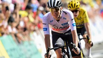 2023-07-13 17:25:19 UAE Team Emirates' Slovenian rider Tadej Pogacar white (L) and Jumbo-Visma's Danish rider Jonas Vingegaard wearing the overall leader's yellow jersey (R) cycle to the finish line of the 12th stage of the 110th edition of the Tour de France cycling race, 169 km between Roanne and Belleville-en-Beaujolais, in central-eastern France, on July 13, 2023. 
Marco BERTORELLO / AFP