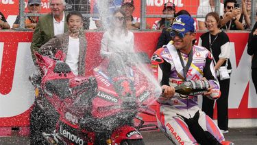 2023-09-30 15:34:20 epa10891350 Spanish MotoGP rider Jorge Martin of Prima Pramac Racing celebrates with champagne after winning a sprint race of the Moto GP Grand Prix of Japan in Motegi, Tochigi Prefecture, northern Japan, 30 September 2023. Binder took send and Bagnaia placed third.  EPA/KIMIMASA MAYAMA