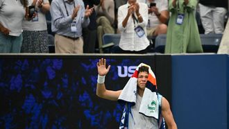 USA's Ben Shelton reacts after being defeated by France’s Adrian Mannarino during their men's singles third round match on day six of the US Open tennis tournament at the USTA Billie Jean King National Tennis Center in New York City on August 29, 2025. 
ANGELA WEISS / AFP