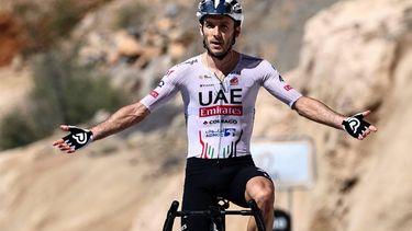UAE Team Emirates British rider Adam Yates gestures as he crosses the finish line to win the fifth stage and the Tour of Oman cycling race, at Jabal Al Akhdhar (Green Mountain) on February 14, 2024. 
Anne-Christine POUJOULAT / AFP