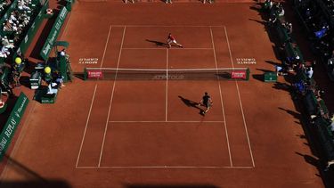 Serbia's Novak Djokovic (Top) and Norway's Casper Ruud compete during their Monte Carlo ATP Masters Series Tournament semi final tennis match on the Rainier III court at the Monte Carlo Country Club on April 13, 2024. 
Valery HACHE / AFP