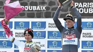 Second placed UAE Team Emirate's Slovenian rider Tadej Pogacar (L) and First placed Alpecin-Deceuninck's Dutch rider Mathieu van der Poel (R) celebrate on the podium of the 122nd edition of the Paris-Roubaix one-day classic cycling race, 259,2 km between Compiegne and Roubaix, northern France on April 13, 2025. 
Jeff PACHOUD / AFP