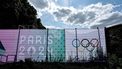 This photograph shows a banner with a sign of Olympic rings on a fence at the Chateau de Versailles, an Olympic venue for the Equestrian and modern Pentathlon, in Versailles, on July 17, 2024, ahead of the Paris 2024 Olympic Games. 
STEPHANE DE SAKUTIN / AFP