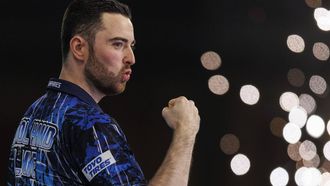 epa11054135 Luke Humphries of England reacts to winning against Scott Williams(not pictured) of England at the semi final match of the Paddy Power World Darts Championship at Alexandra Palace in London, Britain, 02 January 2024.  EPA/TOLGA AKMEN