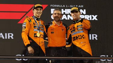 epa12030249 (L-R) First-placed McLaren driver Oscar Piastri of Australia ,McLaren team principal Andrea Stella and third-placed McLaren driver Lando Norris of Britain celebrate on the podium after the Formula One Bahrain Grand Prix in Sakhir, Bahrain, 13 April 2025.  EPA/ALI HAIDER