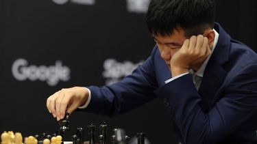 epa11739445 Chess grandmaster Ding Liren of China competes in the first round of the FIDE World Chess Championship against Gukesh Dommaraju of India in Singapore, 25 November 2024.  EPA/HOW HWEE YOUNG