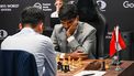 China’s chess grandmaster Ding Liren (L) and India’s chess grandmaster Gukesh Dommaraju (R) compete during the start of the FIDE World Chess Championship in Singapore on November 25, 2024. 
Roslan RAHMAN / AFP