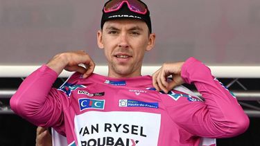 Go Sport-Roubaix Lille Metropole's French rider Samuel Leroux celebrates on the podium wearing the overall leader's pink jersey at the end of the second stage of the 