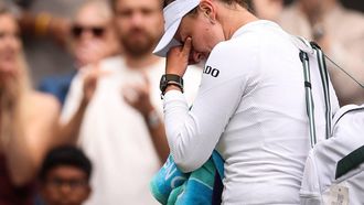 Czech Republic's Barbora Krejcikova cries as she leaves Court 1 following her defeat against USA's Emma Navarro at the end of their women's singles third round tennis match on the sixth day of the 2025 Wimbledon Championships at The All England Lawn Tennis and Croquet Club in Wimbledon, southwest London, on July 5, 2025. 
HENRY NICHOLLS / AFP