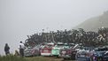 Team support vehicles line the mountain side at the summit of Col de la Loze after the 18th stage of the 112th edition of the Tour de France cycling race, 171.5 km between Vif and Courchevel Col de la Loze, in the Alps, southeastern France, on July 24, 2025. 
Anne-Christine POUJOULAT / AFP