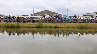 epa11469865 Riders in action during the start of the eleventh stage of the 2024 Tour de France cycling race over 211km from Evaux-les-Bains to Le Lioran, France, 10 July 2024.  EPA/KIM LUDBROOK