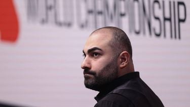 Iran's Hossein Vafaei looks up during his World Snooker Championship Round One match against China's Si Jiahui (not pictured) at The Crucible in Sheffield, northern England on April 22, 2026.  The World Snooker Championship 2025 will take place from April 19 to May 5, 2025.
Darren Staples / AFP