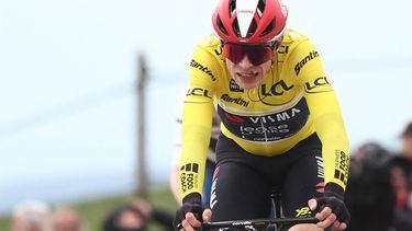 Team Visma-Lease a Bike's Danish rider Jonas Vingegaard wearing the overall leader's yellow jersey reacts as he crosses the finish line of the 5th stage of the Paris-Nice cycling race, 203,3 km between Saint-Just-en-Chevalet and La Côte-Saint-André, on March 13, 2025. 
Anne-Christine POUJOULAT / AFP