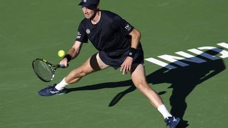 epa11950477 Botic Van de Zandschulp of the Netherlands in action against Novak Djokovic of Serbia during their men's second round match at the BNP Paribas Open tennis tournament in Indian Wells, California, USA, 08 March 2025.  EPA/JOHN G. MABANGLO