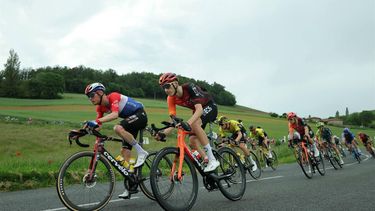Team Visma's Dutch rider Dylan van Baarle (L) and Team Ineos' British rider Ben Turner (2ndL) compete in the fifth stage of the 76th edition of the Criterium du Dauphine cycling race, 167km between Amplepuis and Saint-Priest, central France, on June 6, 2024. 
Thomas SAMSON / AFP