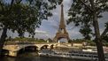 A tourist boat sails under the Pont de lena bridge on the Seine River in Paris, on June 26, 2024. 
OLYMPIA DE MAISMONT / AFP