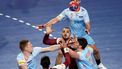 Qatar's left back #44 Amine Guehis (C) fights for the ball during the IHF Men's Handball World Championship Main Round II match between Qatar and The Netherlands at the Arena Varazdin in Varazdin on January 21, 2025. 
Anne-Christine POUJOULAT / AFP