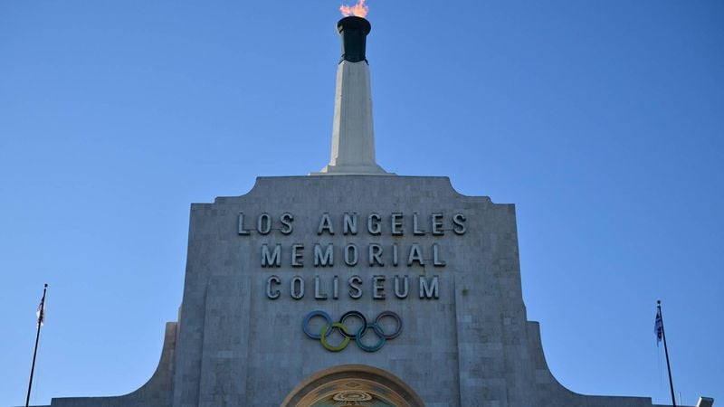 The LA28 Olympic cauldron is lit during a ceremonial lighting at the Memorial Coliseum in Los Angeles on January 13, 2026, ahead of the launch of ticket registration for the 2028 Summer Olympic Games. 
Frederic J. Brown / AFP