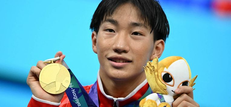 Gold medallist and world record holder Japan's Shin Ohashi celebrates following the victory ceremony of the men's 200m breaststroke swimming event during the 2026 Asian Games at the Tokyo Aquatics Centre in Tokyo on September 24, 2026. 
ANDREW CABALLERO-REYNOLDS / AFP