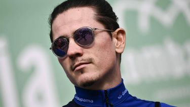 Groupama - FDJ team's French rider David Gaudu looks on from the presentation podium before the start of 118th edition of the Giro di Lombardia (Tour of Lombardy), a 252km cycling race from Bergamo to Como on October 12, 2024. 
Marco BERTORELLO / AFP